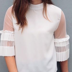 White blouse with detailed sleeve